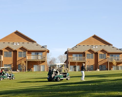 A man playing golf course alongside the resort unit.