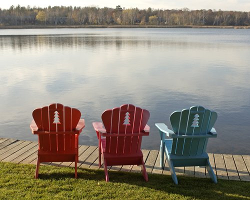 A view of patio furniture facing the lake.