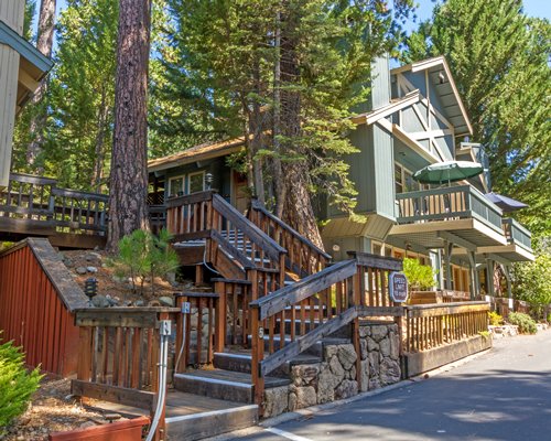 A ground view of the resort unit surrounded by the trees.