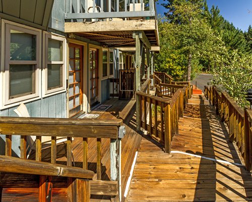 An exterior view of the Mountain Retreat resort unit with the wooden pathway.