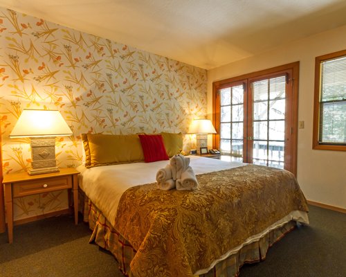 A well furnished bedroom with an outside view.