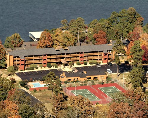 An aerial view of the resort properties surrounded by trees.