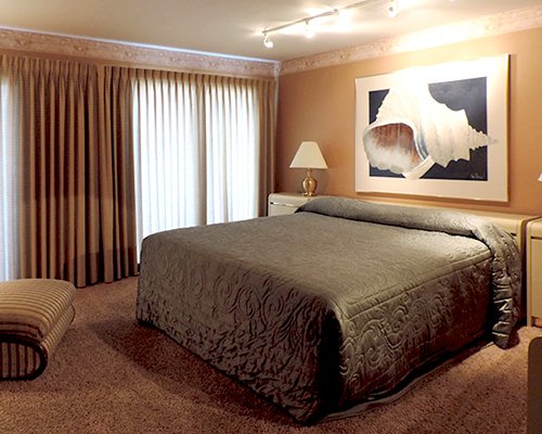 A well furnished bedroom with an outside view.