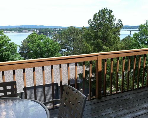 A balcony with patio furniture and the water view.