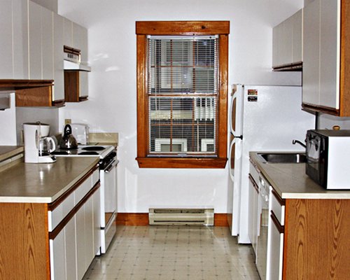 A well equipped kitchen with a microwave.