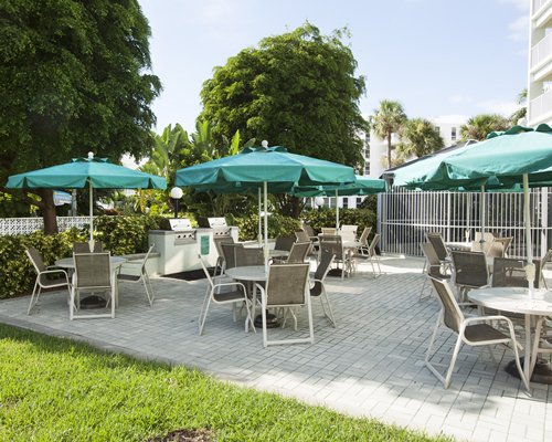 An outdoor dining area with barbecue grills.