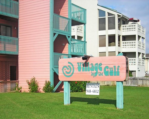 Signboard of Village by the Gulf alongside the resort.