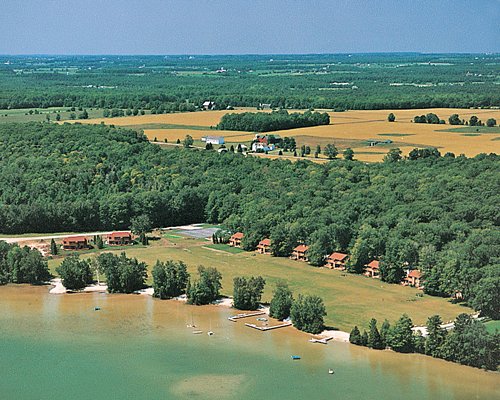 An aerial view of the resort property surrounded by wooded area.