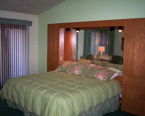 A well furnished bedroom with a king bed.