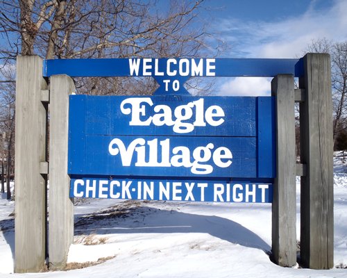A signboard of the Eagle Village resort.
