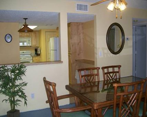 A view of dining area alongside the kitchen.