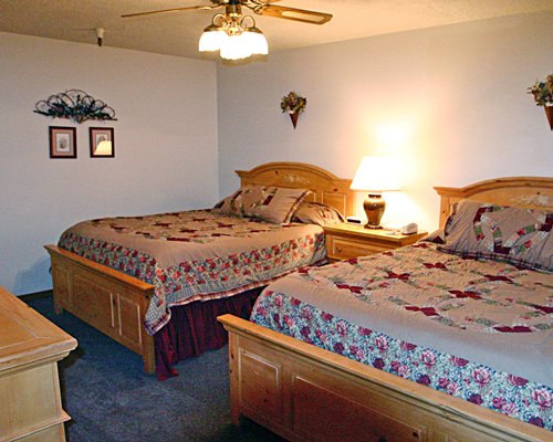 A well furnished bedroom with two beds.