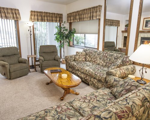 A well furnished living room with pull out sofas.