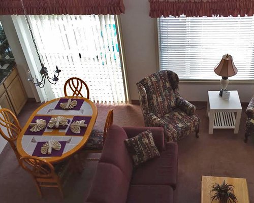 A view of open plan living and dining area with an outside view.