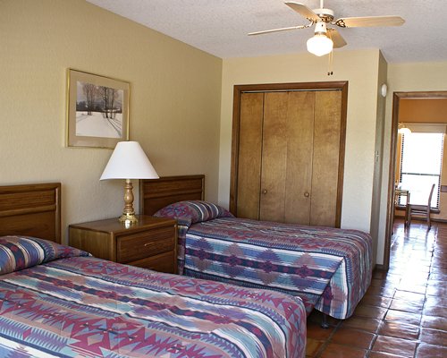 A well furnished bedroom with two beds.