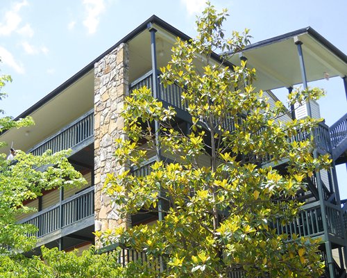 Scenic exterior view of the resort unit with multiple balconies.