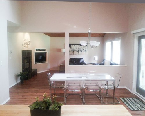 An open plan living room with television and dining area.