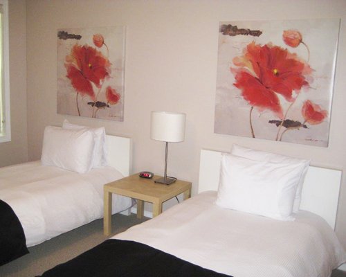 A well furnished bedroom with twin beds.