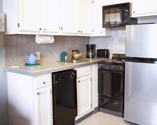 A well equipped kitchen with a microwave oven.