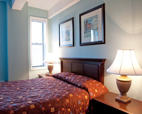 A well furnished bedroom with a queen bed.