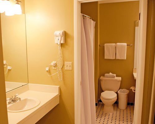 A bathroom with single sink vanity.