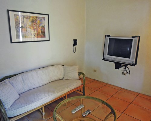 A furnished living room with a television.