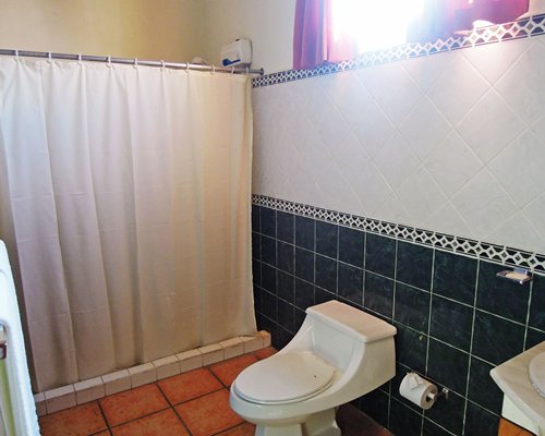 A bathroom with a stand up shower.