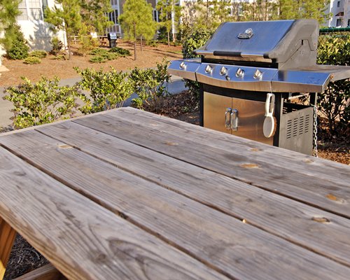 An outdoor dining area with barbecue grills.