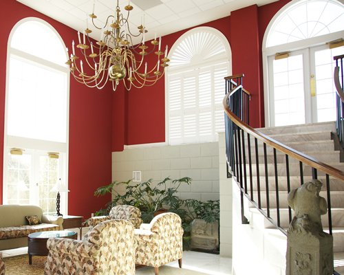 A well furnished living room with a staircase.