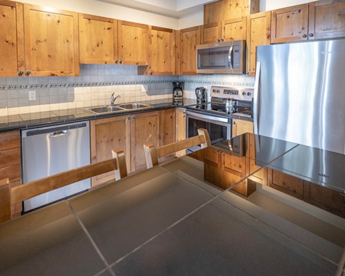 A well equipped kitchen with a microwave oven.