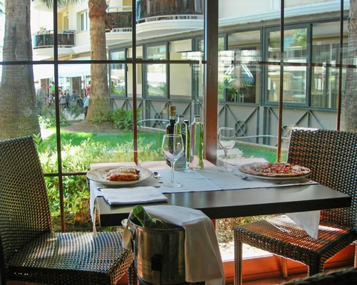 An indoor fine dining area at the resort with an outside view.