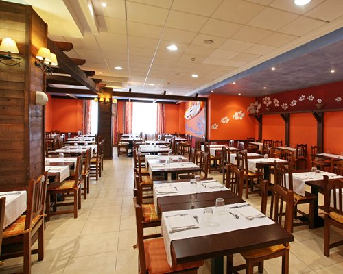 An indoor fine dining restaurant with multiple dining tables.