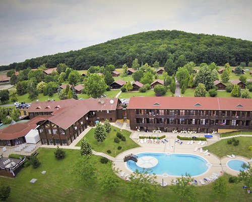 An aerial view of the resort properties surrounded by trees.