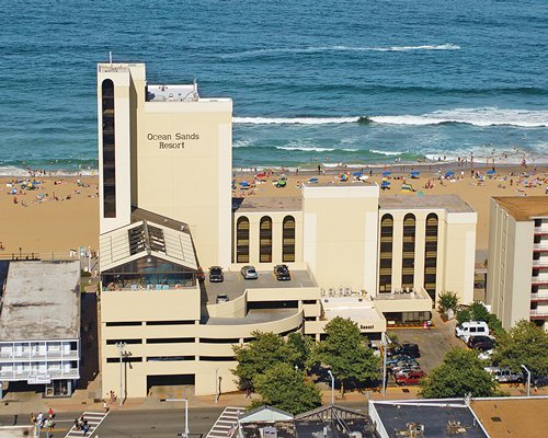 An exterior view of the Ocean Sands Resort alongside the beach.