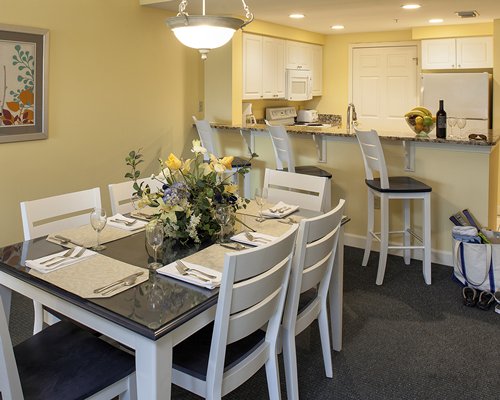 A well equipped kitchen with breakfast bar and dining area.