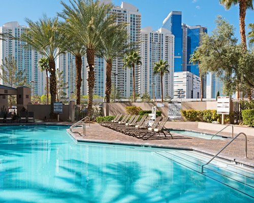 Swimming pool with plenty of shaded lounge areas.