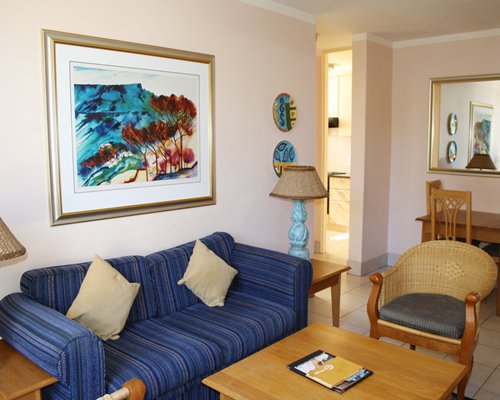 A well furnished living room with double pull out sofa.