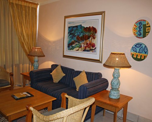 A well furnished living room with a double pull out sofa.