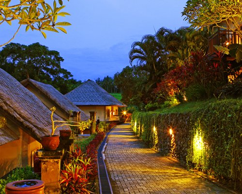 A pathway alongside the resort at night.