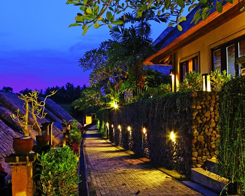 A pathway leading to the resort unit at night.