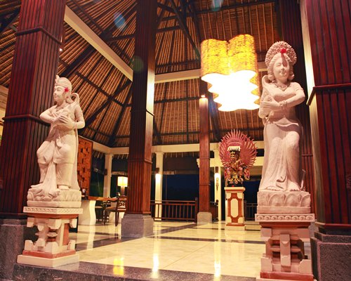 A hallway with statues.