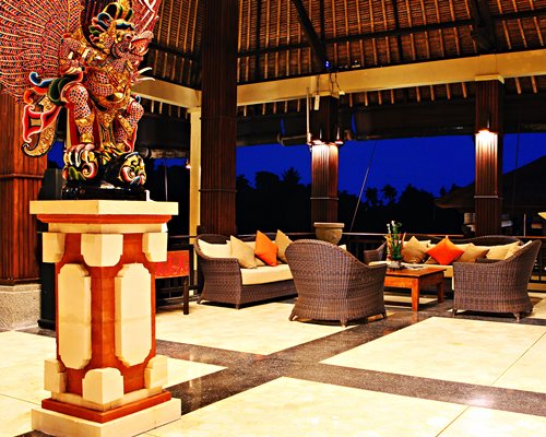 A well furnished indoor lounge area with an outside view.