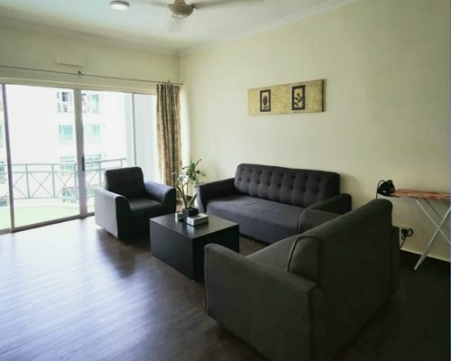 A well furnished living room with pull out sofa.