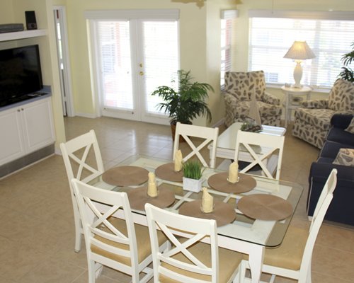 A well furnished bedroom with two twin beds and an outside view.