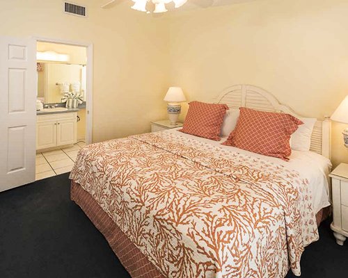 A well furnished bedroom with king bed.