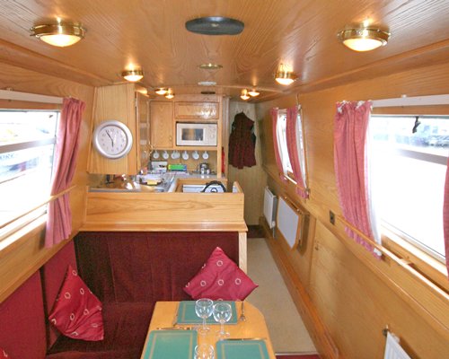 A well furnished living area alongside the kitchen at the boat.