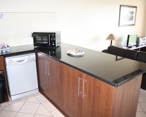 A well equipped kitchen with breakfast bar.