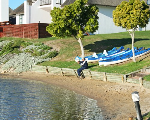 A view of the waterfront alongside trees and resort units.