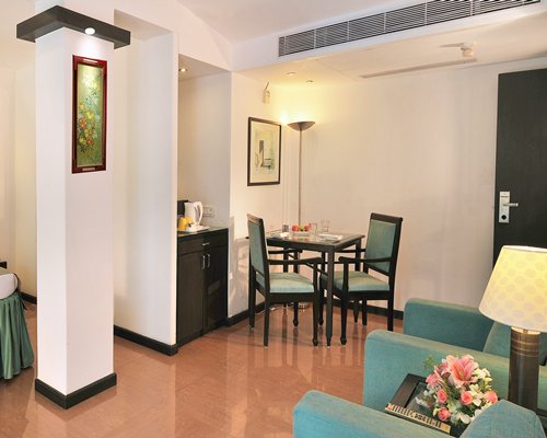 An open plan living and dining area with a pull out sofa.