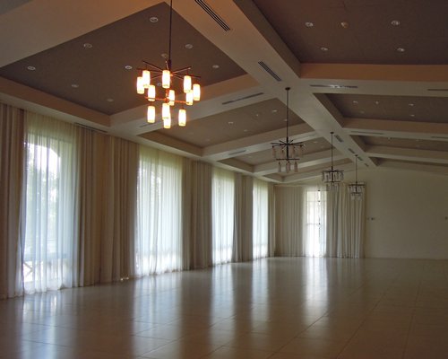 An interior of a room with a chandelier.